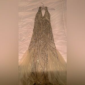 Prom/Pageant gown with sequin’s through out gown with mermaid tail bottom.